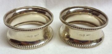 A pair of George V Napkin Rings, circular shaped with beaded detail, Birmingham 1921, (2)