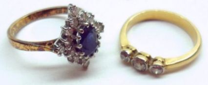 A hallmarked 18ct Gold centre oval Sapphire and small brilliant cut Diamond surround Cluster Ring,