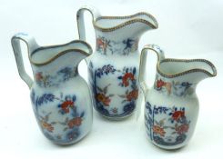A Graduated Set of three 19th Century Davenport Jugs, decorated with transfer printed blue and