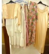 A quantity of approximately 17 mid-20th Century Ladies Undergarments and Nightdresses to include