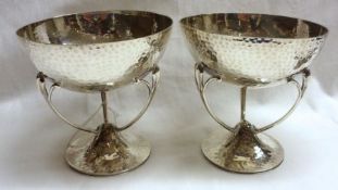 A good pair of Edward VII Arts & Crafts style Bon-Bon Dishes, the circular spot-hammered bases
