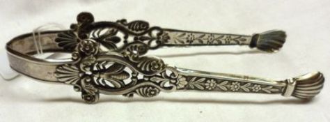 A pair of 19th Century Continental Silver Sugar Tongs, pierced and embossed with bees and floral