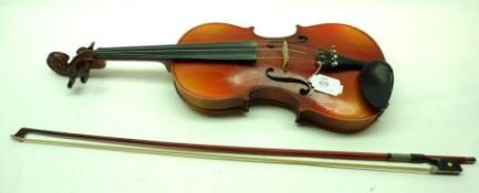 A modern Chinese Student Violin with two-piece back, double purfling sides, finished in pale-mid