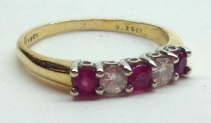 A hallmarked 18ct Gold two small brilliant cut Diamond and three small Ruby line set Ring, the two