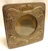 A small Art Nouveau Silver mounted Photograph Frame with stylised iris and scroll designs, 2” diam