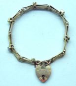 An early 20th Century yellow metal Gate Link Design Bracelet, the panels interspersed by Opals and