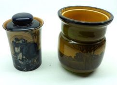 A Royal Doulton Series Ware Tobacco Jar, decorated with a monk in a cellar, (extensively cracked and