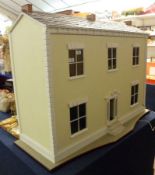 An Edwardian Refurbished Dolls House of timber construction, removable front panel opens to reveal