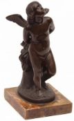 An unsigned Bronze Study of a winged putto standing with a robe and quiver behind, raised on a