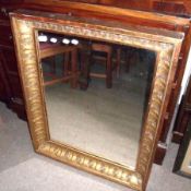 A Rectangular Wall Mirror in gilt frame with acanthus leaf decoration, 34” wide