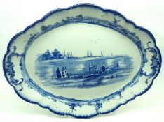 A Doulton Burslem Double-Handled Shaped Oval Meat Plate, typically decorated in blue, 17 ½” long