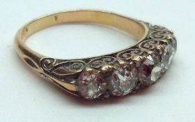 An unmarked precious metal five old cut Diamond Ring, over 1ct total