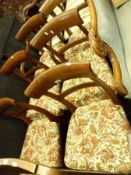 A set of six Victorian Mahogany Bar Back Dining Chairs (one carver) of typical form, with floral