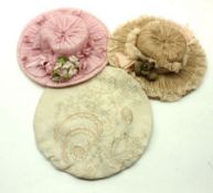 Two Dolls French Silk Bonnets, one Pink decorated with ribbons and flowers, the other decorated with