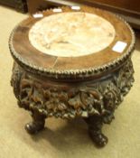 An early 20th Century Oriental Hardwood Marble Top Plant Stand, profusely carved with floral