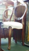 A set of three Victorian Mahogany Balloon Back Dining Chairs with calico upholstered seats, raised