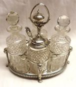 A small Victorian four bottle Cruet, oval shaped with leaf embossed edged plain centre, the circular