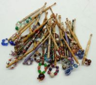 Forty assorted modern Lace Bobbins with painted shanks in various designs, finished with beaded