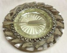 A late Victorian Irish Butter Dish, circular shaped with wavy embossed edge, replacement glass
