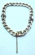 A hallmarked 9ct Gold flattened curb link Bracelet, weighing approximately 14gm