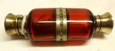 A Victorian Cranberry glass double ended Scent Bottle/Smelling Salts Bottle of oval section, with