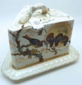 A late 19th/early 20th Century Continental wedge-formed Cheese Dish, decorated with birds amongst