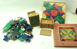 A Boxed Wooden Mosaic Puzzle; together with a Large Piece Die-Cut Jigsaw and a Wooden Dolls