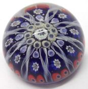 A 20th Century Paperweight with central rosette of coloured canes to radiating Latticinio strands on