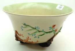 A Clarice Cliff Apple Blossom design Bowl, the sides decorated with raised foliage, raised on four