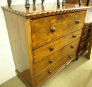 A Victorian Mahogany Chest of four full length drawers, turned knob handles, raised on turned