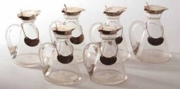 A rare set of six Edward VII conical glass Whiskey Tots with star cut bases, solid looped handles,