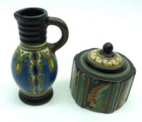 A Gouda Pottery Baluster Vase (foot chip); a further Gouda Hexagonal Covered Pot, 4 ½” and 3 ¼” high