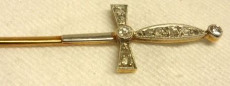 An attractive early 20th Century Stick Pin, in the form of a sword with small old cut Diamonds to