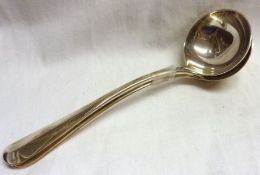 A heavy pair of George V Sauce Ladles, Hanoverian rattail pattern with circular bowls, 7” long,