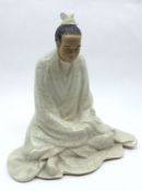 An Oriental crackle glaze Model of a kneeling figure, 8” high