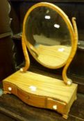 A 19th Century Faded Mahogany Swing Dressing Table Mirror, the oval adjustable mirror on side
