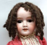 Schoenau & Hoffmeister Bisque Head Child Character Doll, with brown weighted sleep glass eyes,
