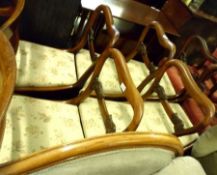 A set of six early Victorian Rosewood Balloon Back Dining Chairs, floral upholstered push-out seats,