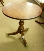 A small Mahogany Wine Table, the round top to a turned pedestal and a tripod base, fitted with brass