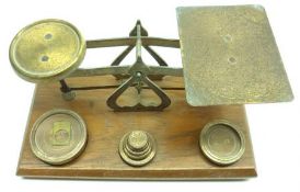 A Set of Vintage Brass Postal Scales and Weights on an Oak Base, 7 ½” long