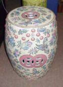 A 20th Century large Ceramic Oriental Garden Stool, decorated with butterflies and foliage, on a