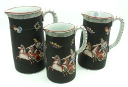 A set of three 19th Century Graduated Jugs, decorated with Roman Chariot on a black background, to