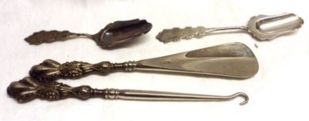 A Mixed Lot comprising: An embossed Silver handled Button Hook and Shoe Horn, 7” long, Birmingham
