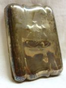An Edwardian Cigarette Case of shaped rectangular design, monogram to an embossed shield to the