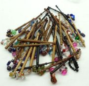 Forty mixed modern Treen Lace Bobbins, some with turned shanks, finished with beaded spangles