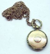 A small Victorian Mixed Metals Circular Hair Panel Locket, with engine-turned decoration and