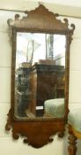 A Georgian Fretwork Framed Oak Wall Mirror of typical form, some losses to woodwork and
