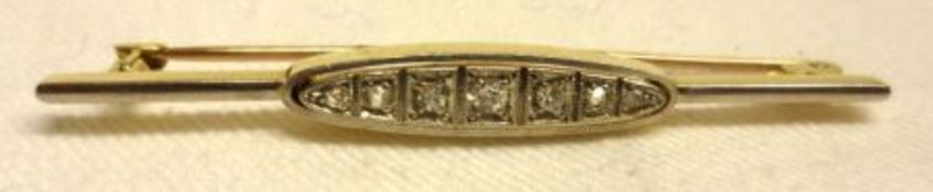 An early 20th Century precious metal Bar Brooch, an oval panel to the centre set with seven