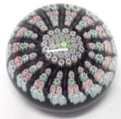 A 20th Century Paperweight decorated with central rosette of pink, purple, green and red coloured