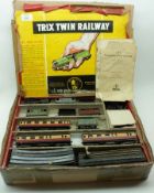 A Trix-Twin Railway System, comprising of black Tack Locomotive, three Carriages, open Wagons etc;